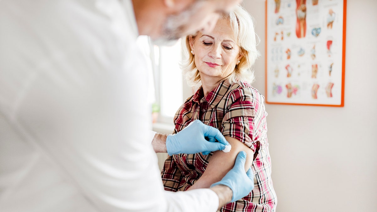 Senior Woman receives the vaccine